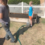 boy watering garden